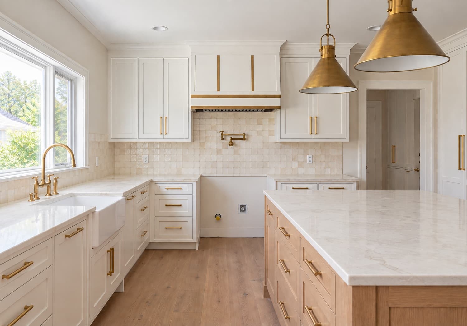 The same kitchen with stone countertops and handmade tile installed